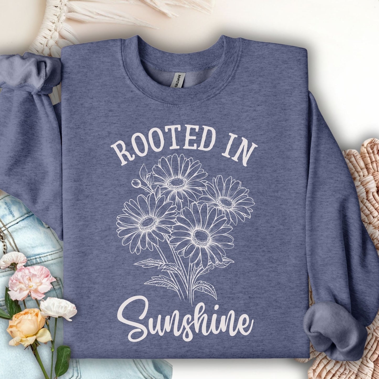 Heather Sport Dark Navy sweatshirt with "Rooted in Sunshine" and daisy bouquet graphic.