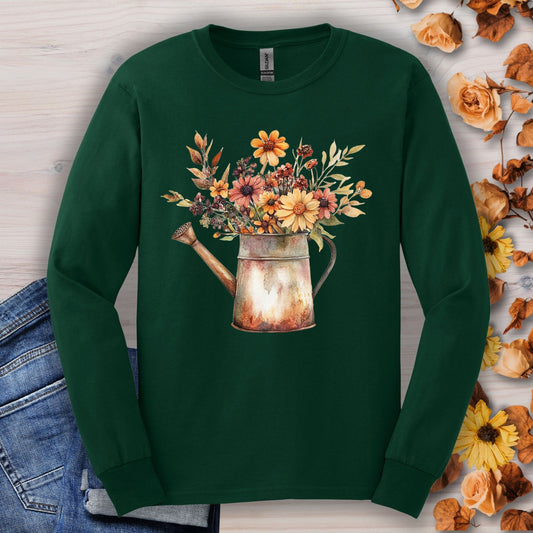 Forest Green long sleeve tee with a vintage watercolor watering can overflowing with autumn wildflowers.