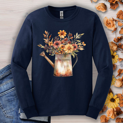 Navy long sleeve tee with a watercolor rustic watering can overflowing with autumn flowers.