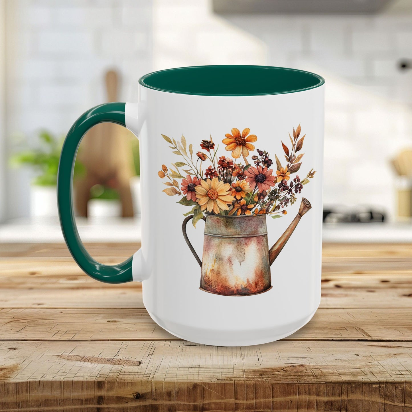 White ceramic mug with a green handle and interior, featuring a watercolor rustic autumn floral watering can design.