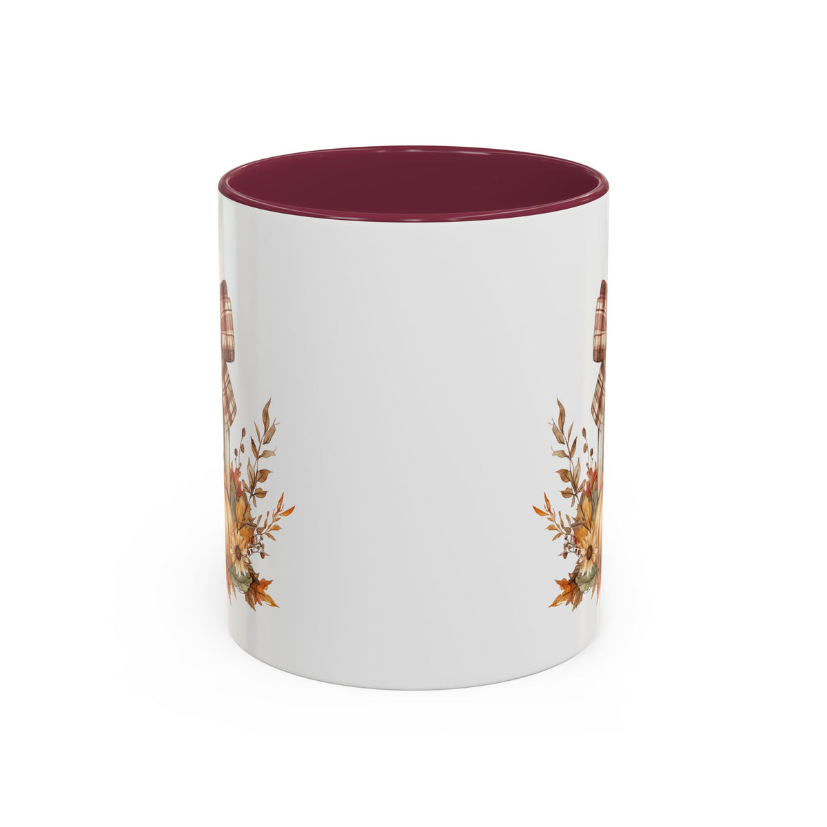 White ceramic mug with a maroon interior and handle, featuring a rustic plaid bow, lantern, and autumn foliage design.