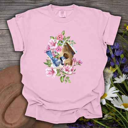 Pink S-size t-shirt with a rustic birdhouse, blue jay, and pink floral watercolor design.