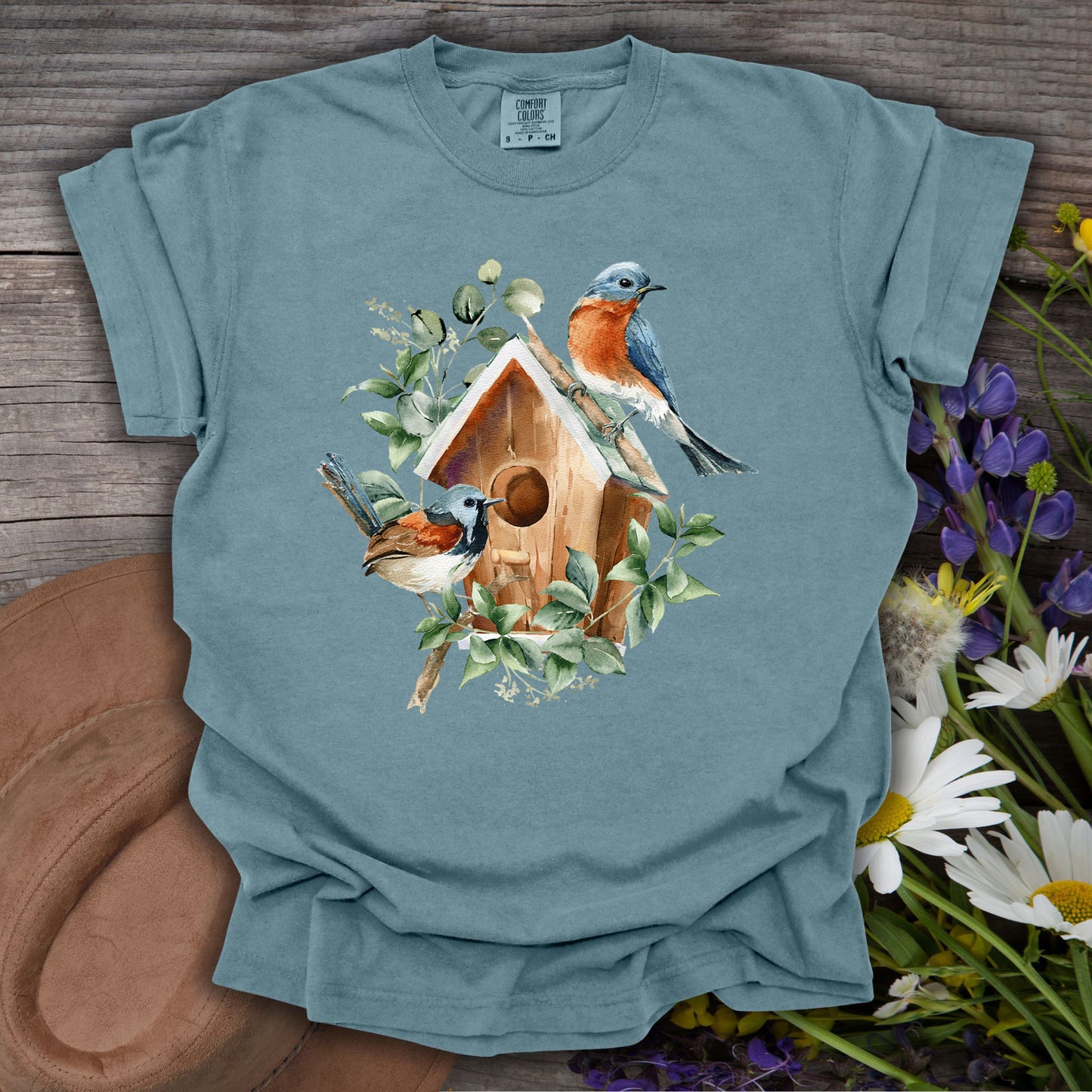 Ice Blue t-shirt with watercolor rustic birdhouse, two bluebirds, and botanical elements.