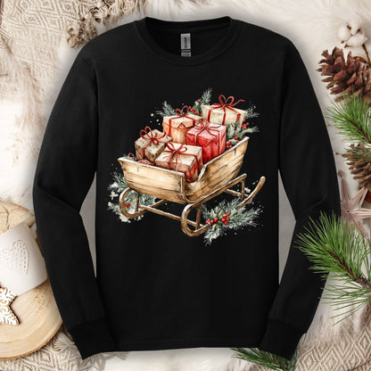 Black Gildan long sleeve tee with a watercolor rustic Christmas sleigh full of gifts and greenery.