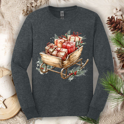 Dark Heather Gildan long sleeve tee with a rustic watercolor sleigh full of red and brown Christmas gifts.