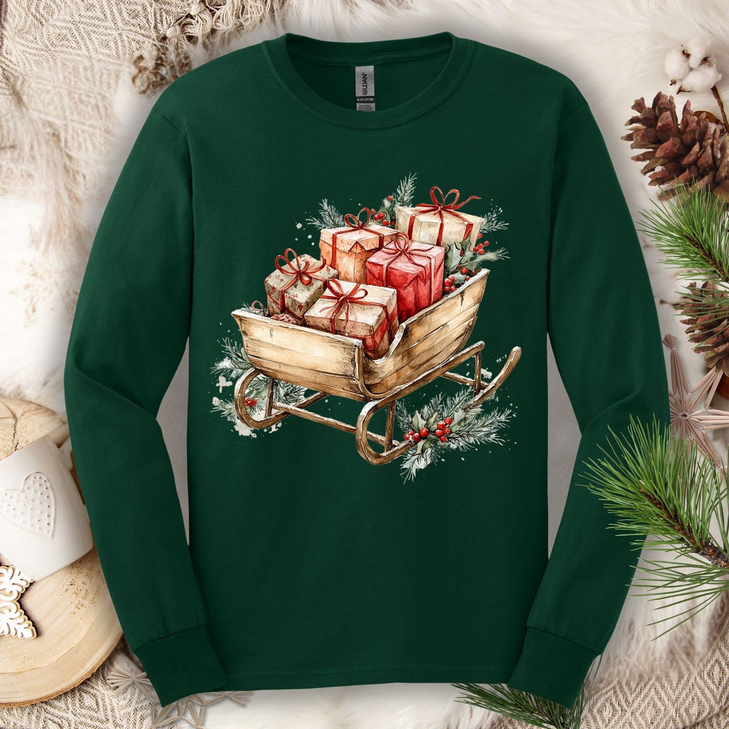 Forest Green Gildan long sleeve tee with a watercolor rustic Christmas sleigh full of gifts and greenery.