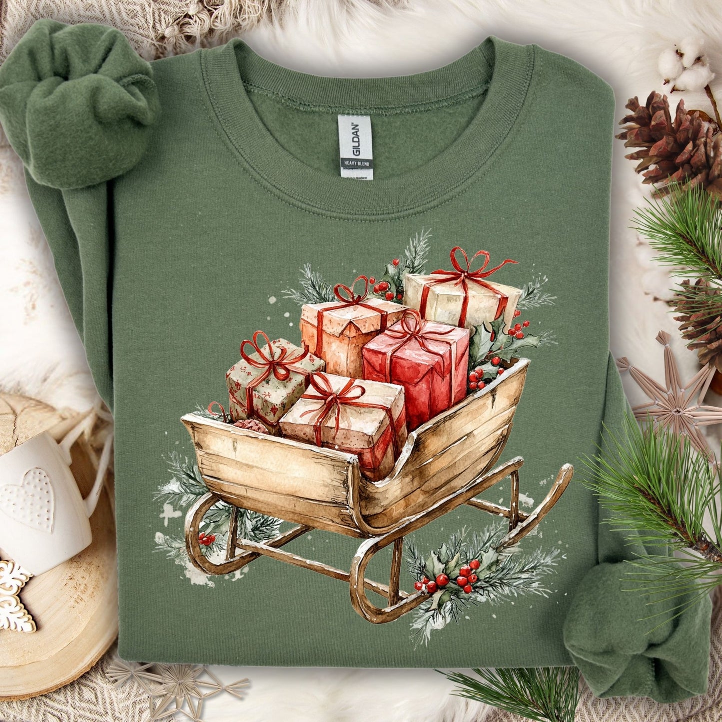 Military Green Gildan fleece sweatshirt with a rustic watercolor Christmas sleigh full of gifts and evergreens.