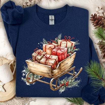 Navy Gildan fleece sweatshirt with a rustic watercolor sleigh overflowing with Christmas gifts and evergreens.