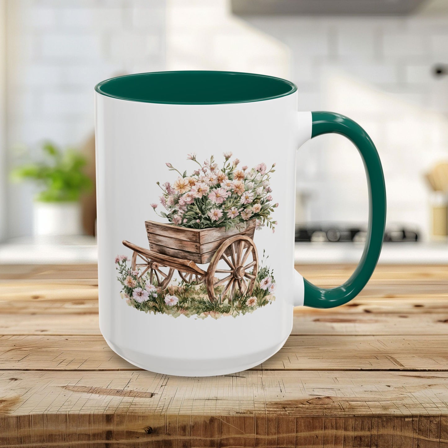 15oz white ceramic mug with green handle and interior, featuring a watercolor wheelbarrow with pink blooms.