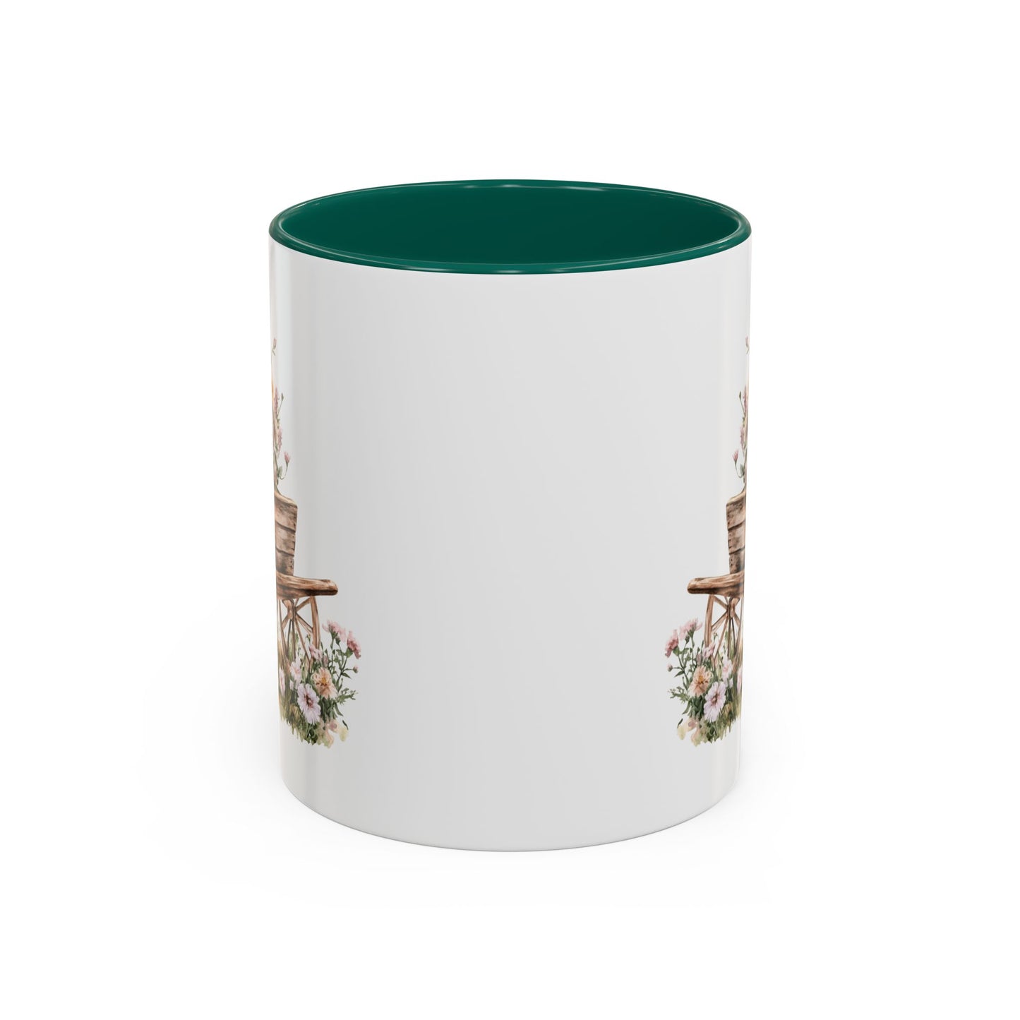 White ceramic mug with green interior and handle, featuring a watercolor wheelbarrow with pink blooms.
