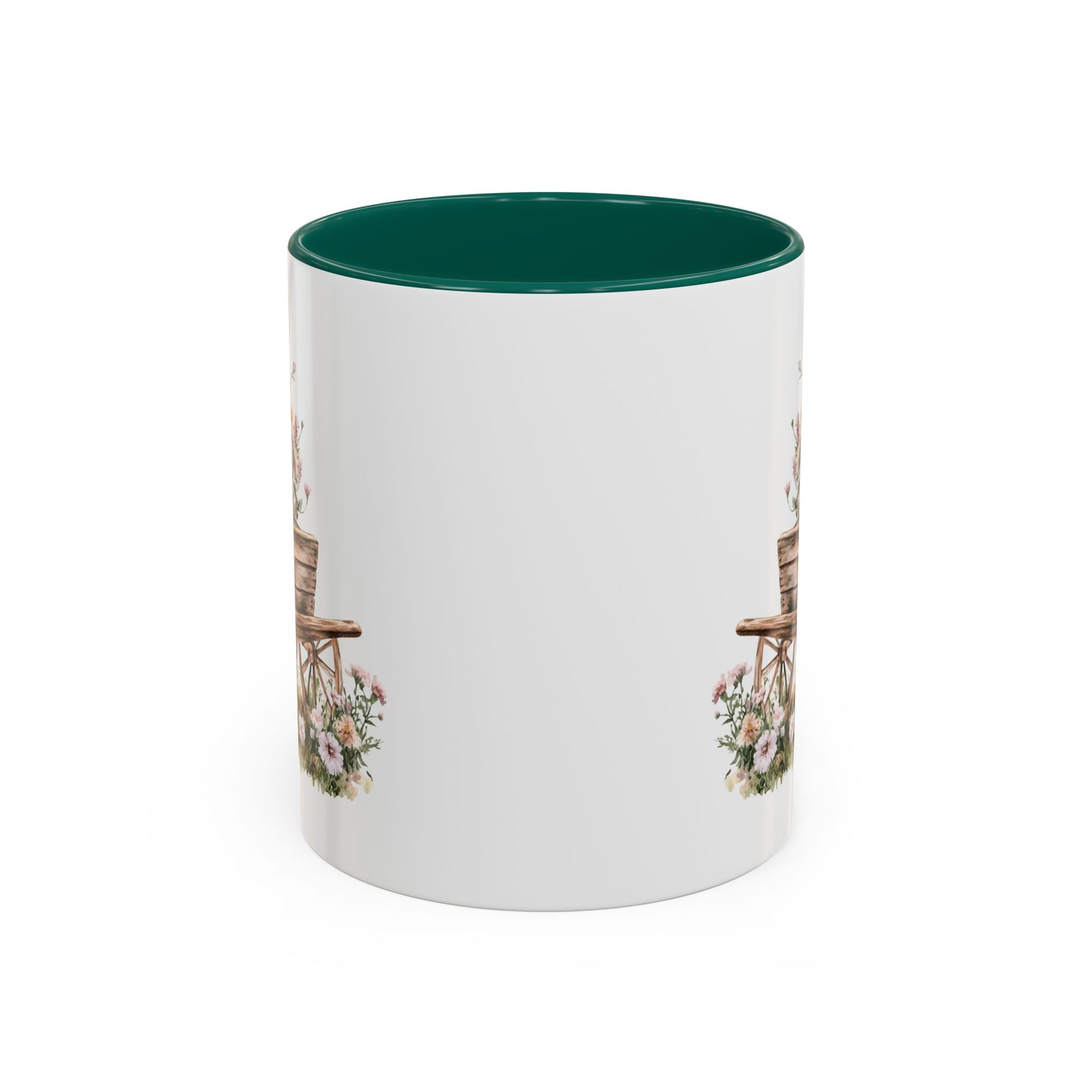White ceramic mug with green interior and handle, featuring a watercolor wheelbarrow with pink blooms.