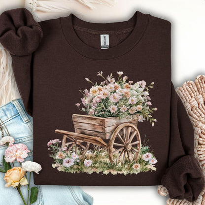 Dark chocolate Gildan sweatshirt with a rustic wooden wagon overflowing with pink carnations.
