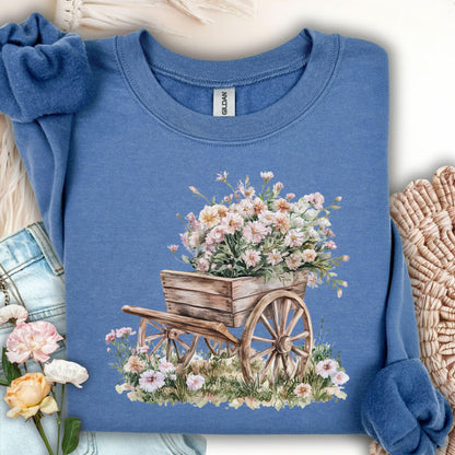 Indigo blue sweatshirt with a watercolor rustic wooden wagon overflowing with pink carnations.