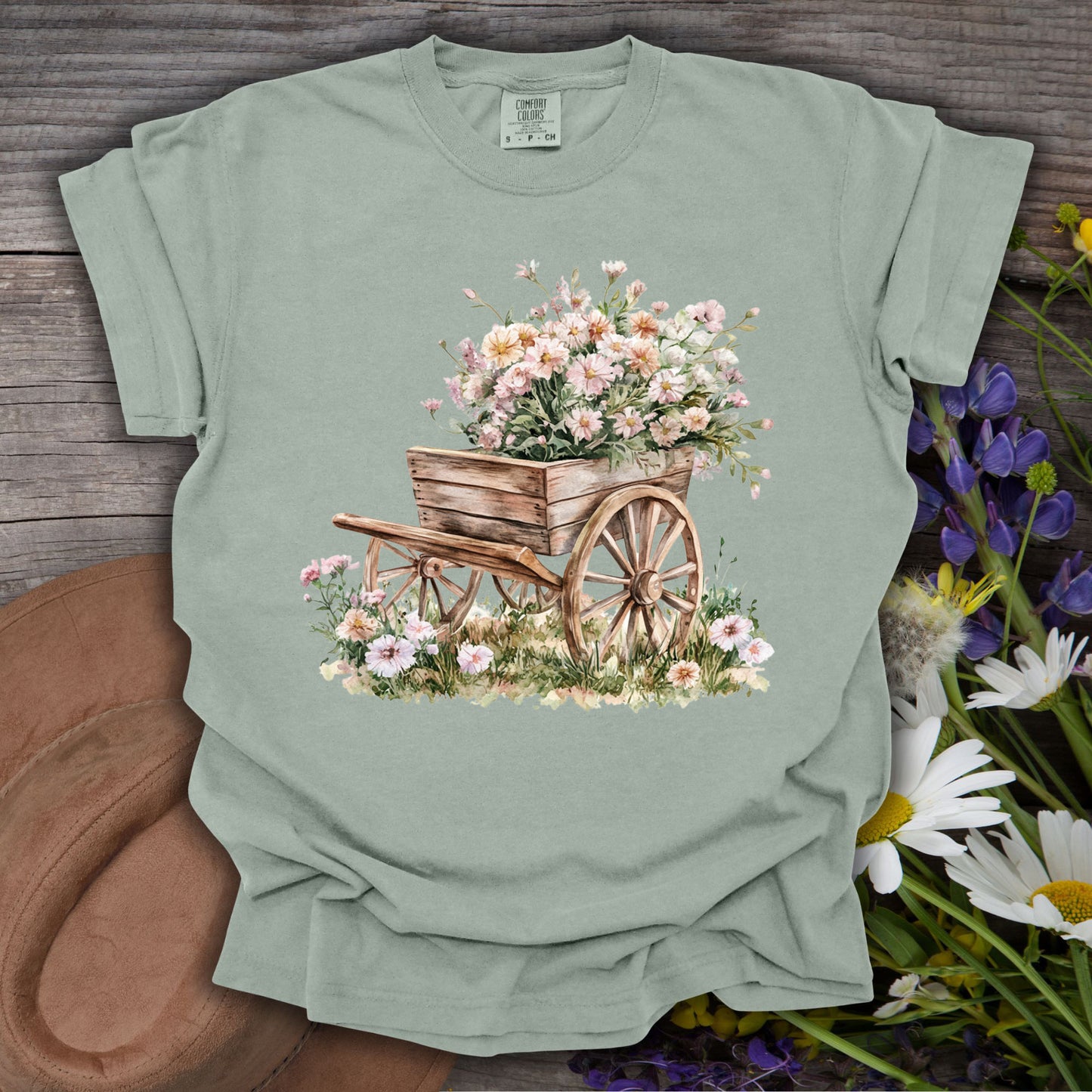 Bay S-sized t-shirt with a rustic wooden garden wagon overflowing with delicate pink and white flowers.