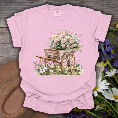 Blossom pink S t-shirt with a vintage botanical illustration of a rustic wooden wagon overflowing with delicate flowers.