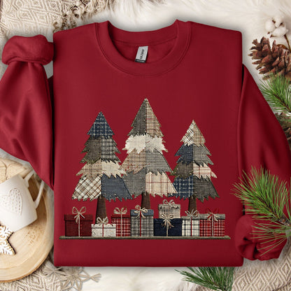Cardinal Red Gildan sweatshirt with faux patchwork Christmas trees and gifts, on a cozy white blanket.