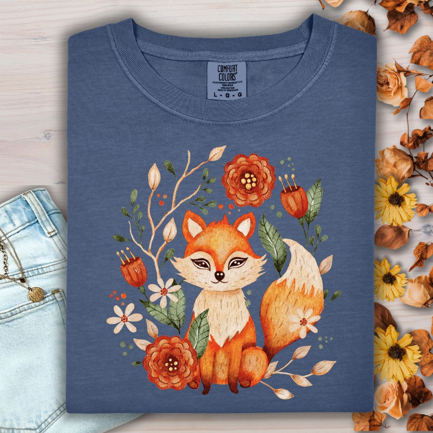 Denim Comfort Colors tee with a rustic folk art fox and floral wreath design.