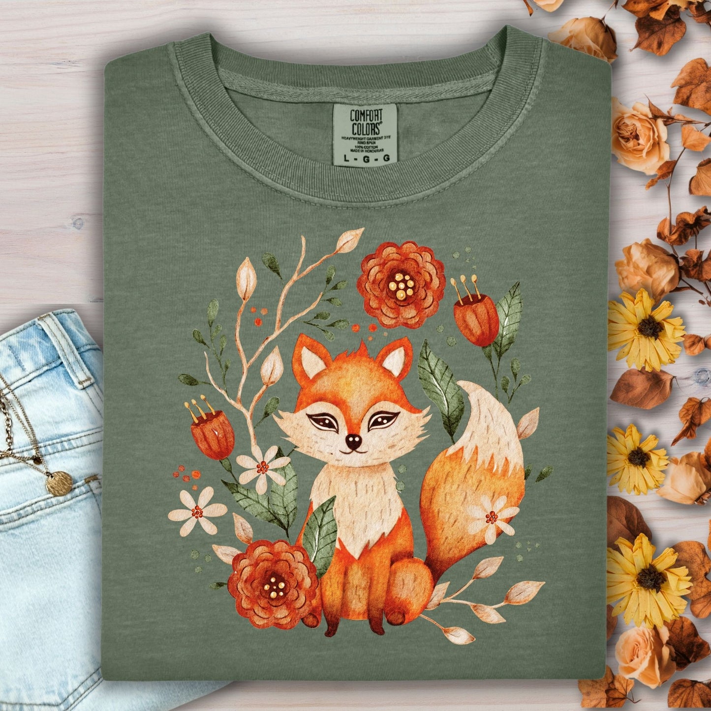 Moss green Comfort Colors tee with a rustic folk art fox and floral design.