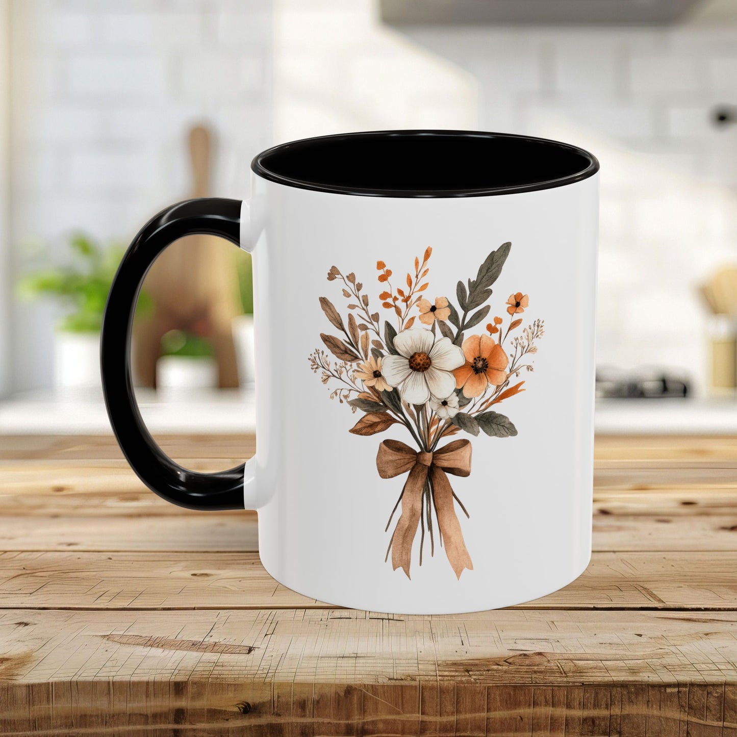 White ceramic mug with black handle and interior, featuring a sepia and cream floral bouquet design.