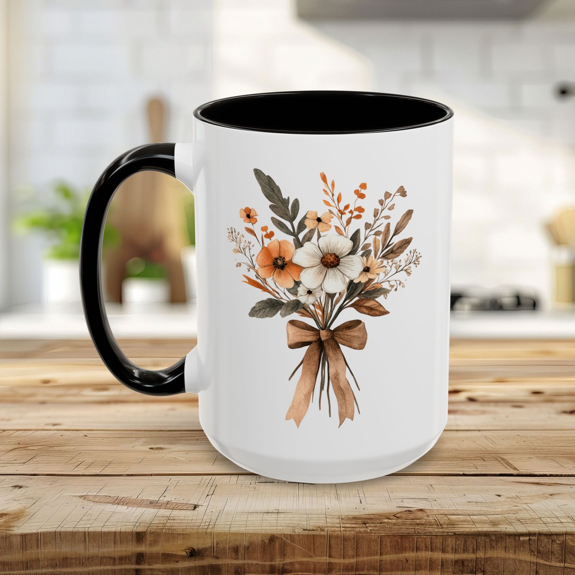 White ceramic mug with black handle and interior, featuring a sepia and cream floral bouquet design.