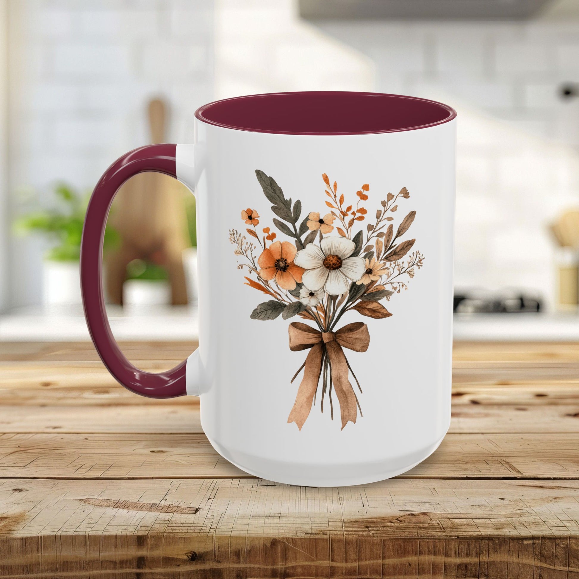 White ceramic mug with a maroon handle and interior, featuring a sepia and cream floral bouquet design.