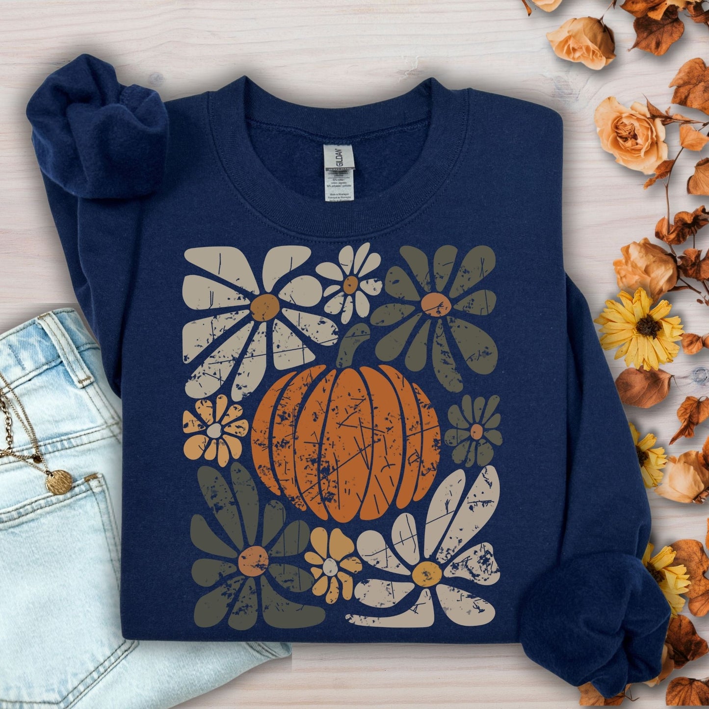 Navy garment-dyed cotton sweatshirt with a rustic pumpkin and floral design.