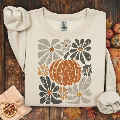 Sand garment-dyed cotton sweatshirt with a rustic orange pumpkin and retro floral design.
