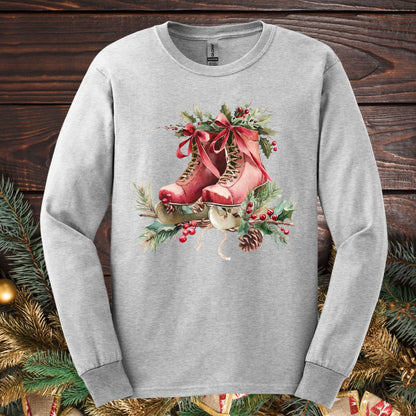 Ash long-sleeve tee with watercolor rustic red ice skates, holly, and evergreens.