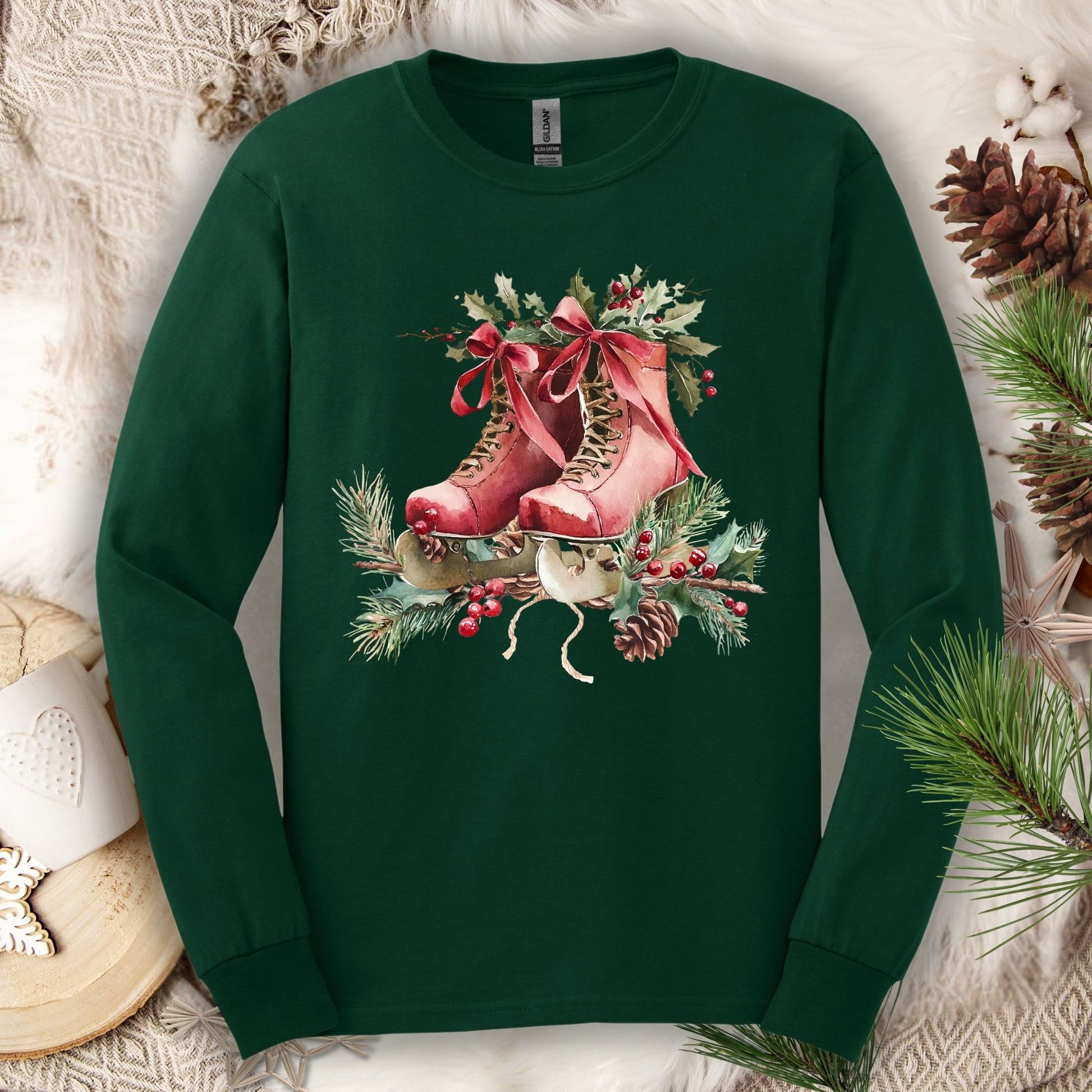 Forest Green S long sleeve tee with watercolor red ice skates, holly, and evergreens.