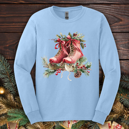 Light Blue S long sleeve tee with watercolor red ice skates, holly, and evergreens.