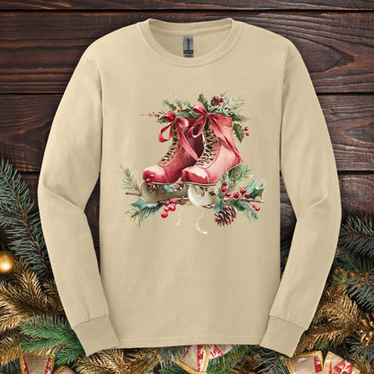 Sand long sleeve tee with watercolor red ice skates, holly, and evergreens.