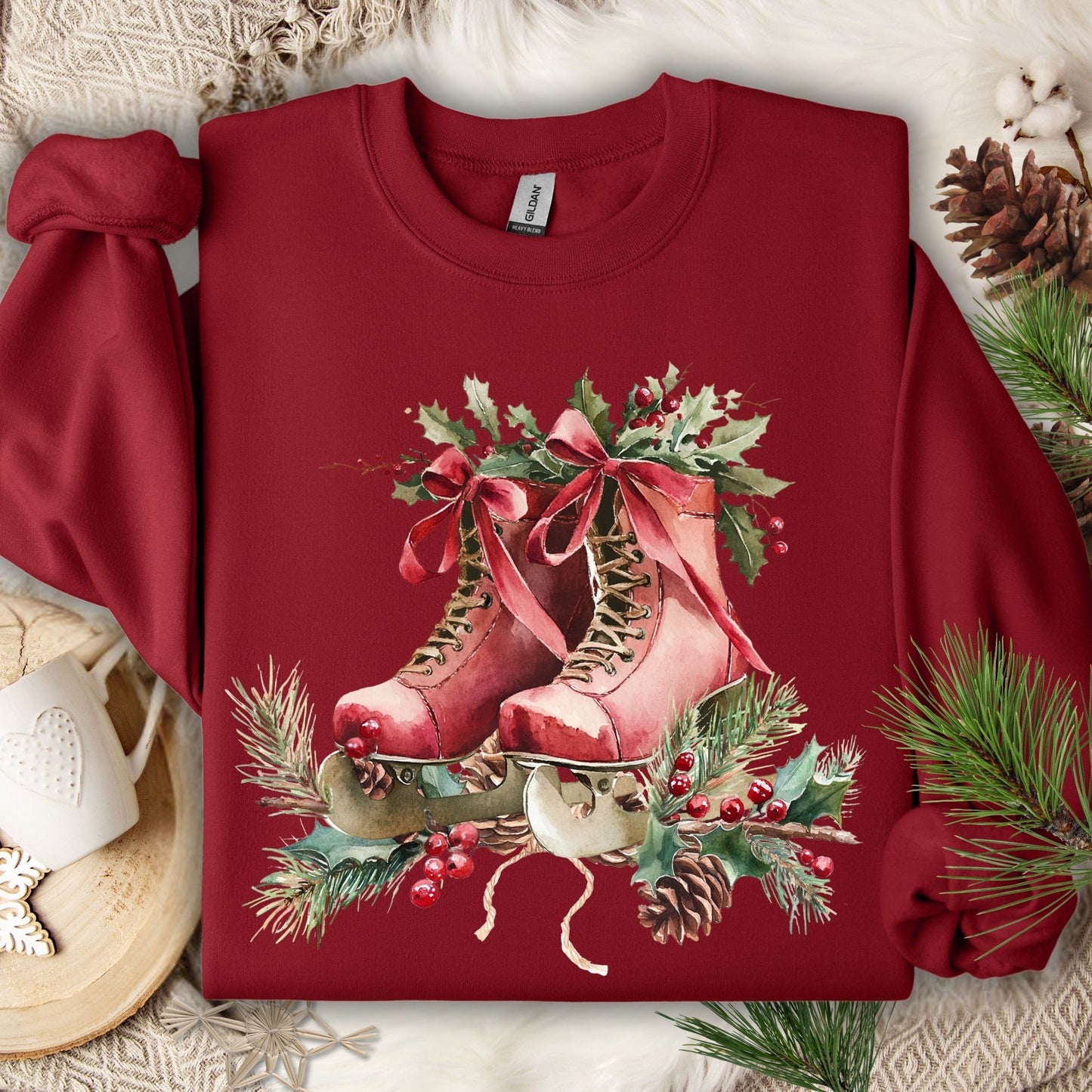Cardinal red fleece sweatshirt with watercolor rustic red ice skates, holly berries, and winter greenery.