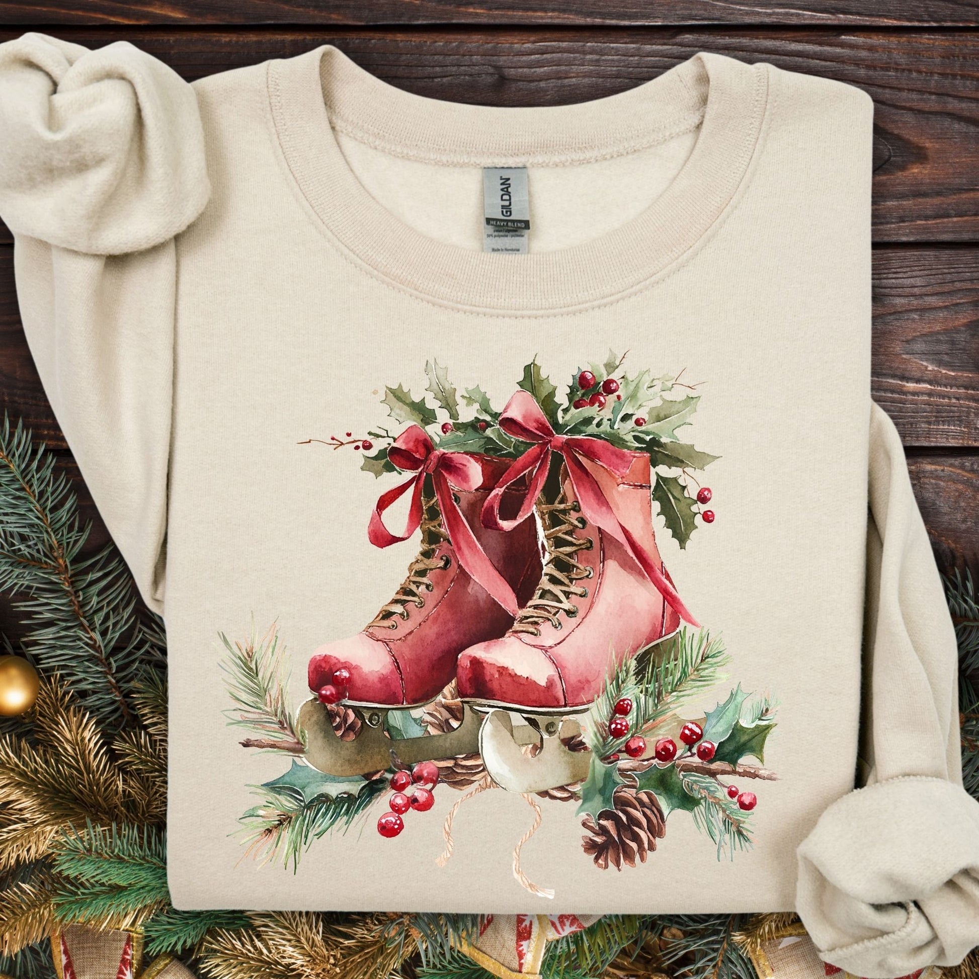 Sand fleece sweatshirt with rustic red watercolor ice skates, holly, and winter greenery.