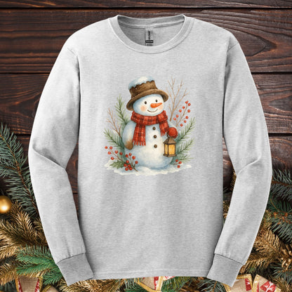 Ash Gildan 2400 long sleeve tee with watercolor snowman, lantern, and snowy branches.