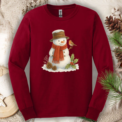 Cardinal Red long sleeve tee with a rustic watercolor snowman, holly, and sparrow design.