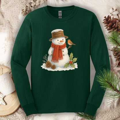 Forest Green Gildan long sleeve tee with a rustic watercolor snowman, holly, and sparrow.