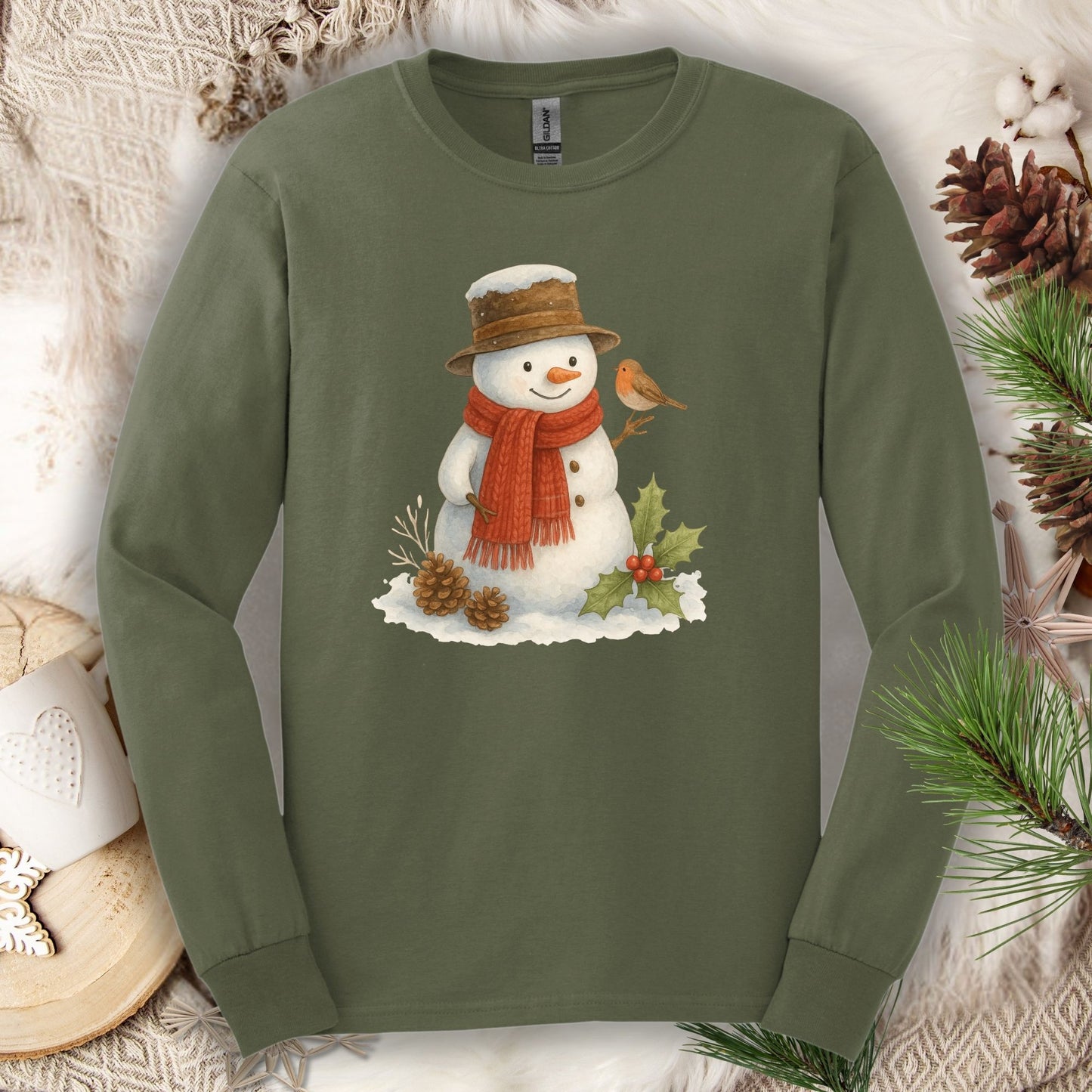 Military Green long sleeve tee with a rustic watercolor snowman, holly, and sparrow design.