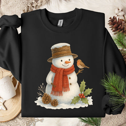 Black Gildan 18000 sweatshirt with a watercolor snowman, red scarf, brown hat, sparrow, and holly.