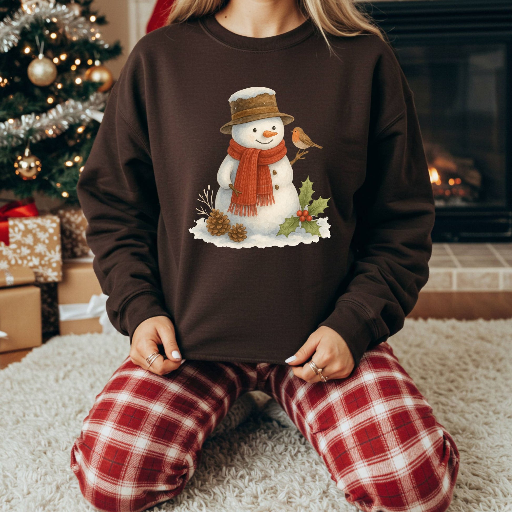 Brown Gildan 18000 sweatshirt with a watercolor snowman, holly, and sparrow design.