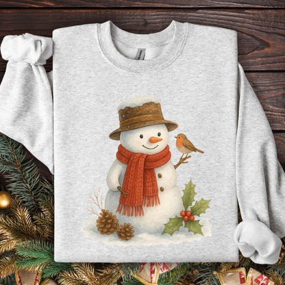 Ash gray Gildan 18000 sweatshirt with a watercolor snowman, sparrow, holly, and pinecones.