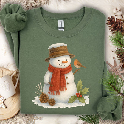 Military Green Gildan 18000 sweatshirt with a watercolor snowman, sparrow, holly, and pinecones.