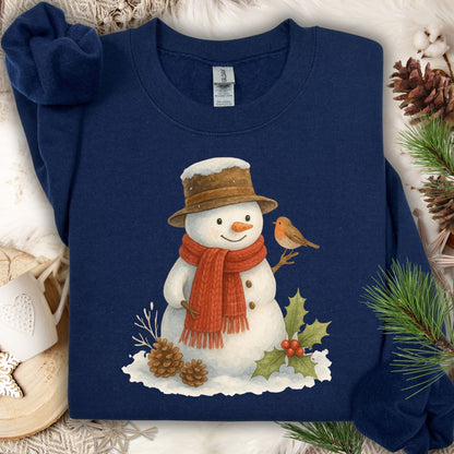 Navy Gildan 18000 sweatshirt with a watercolor snowman, holly, pinecones, and a sparrow.
