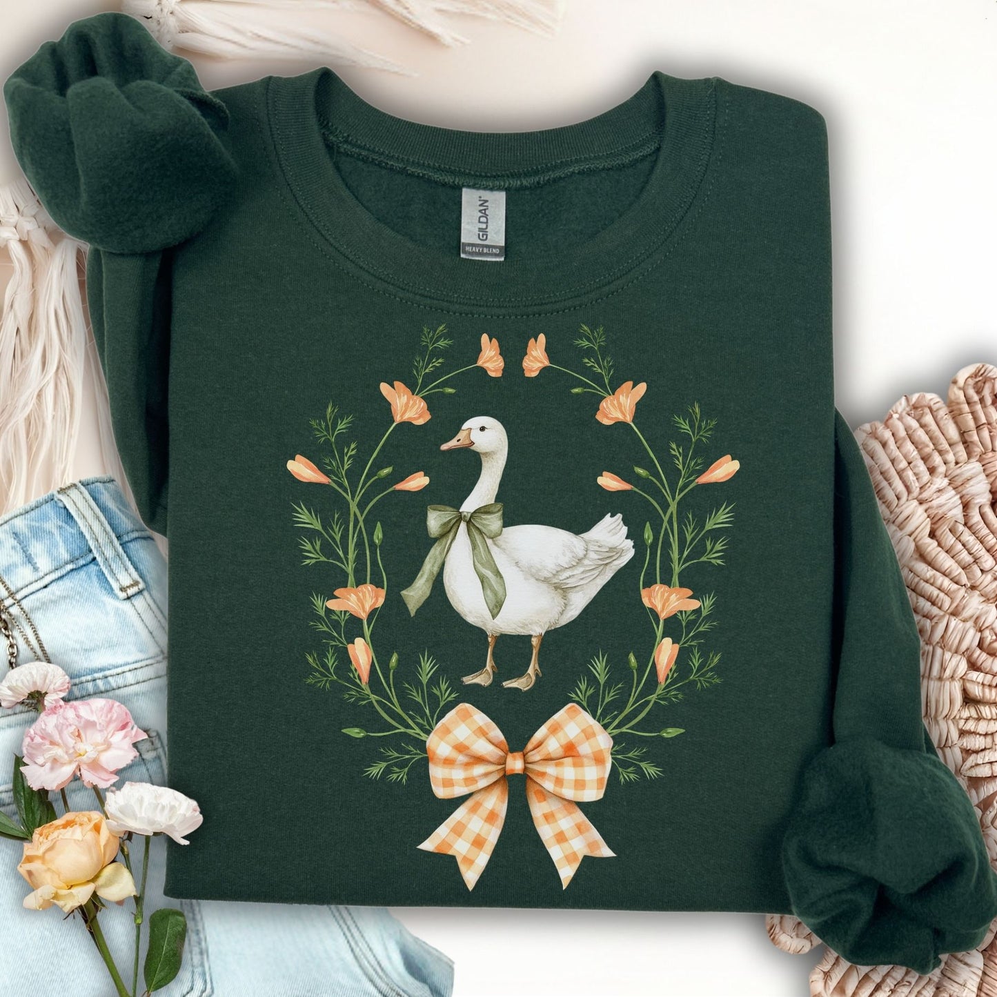 Forest Green crewneck sweatshirt with a white goose, floral wreath, and gingham bow design.