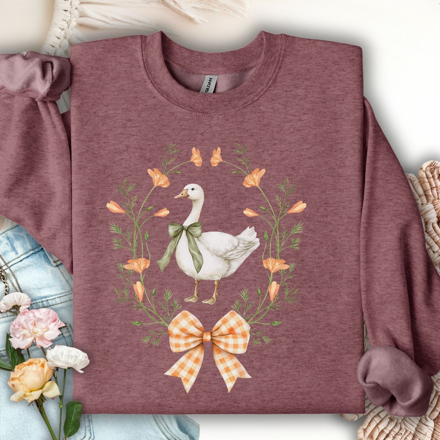 Heather Sport Dark Maroon crewneck sweatshirt with a goose, wildflower wreath, and gingham bow design.