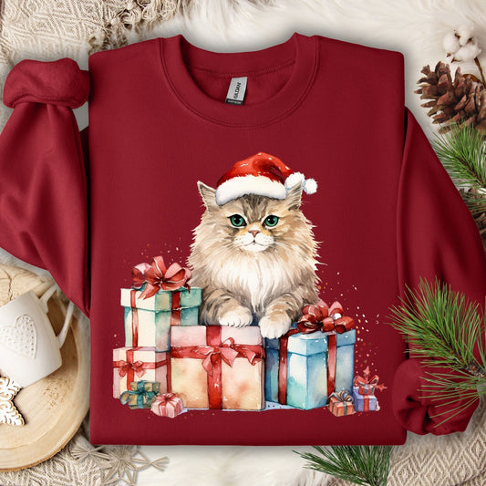 Cardinal Red Gildan sweatshirt with a watercolor cat in a Santa hat on colorful Christmas presents.