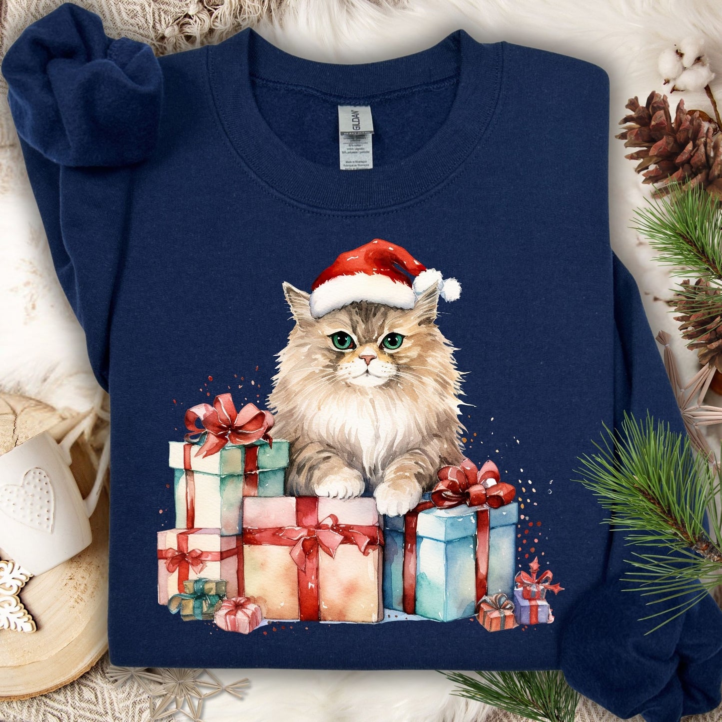 Navy Gildan sweatshirt with a watercolor cat in a Santa hat on colorful Christmas presents.