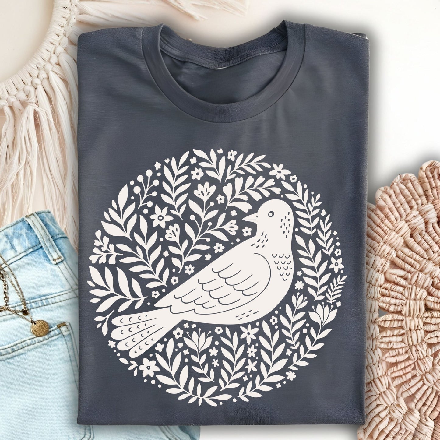 Dark Heather S t-shirt with a white Scandinavian bird and floral art design.