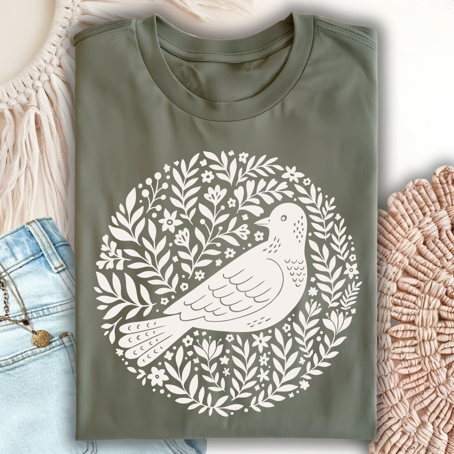 Military green S t-shirt with a white Scandinavian bird and floral wreath design.