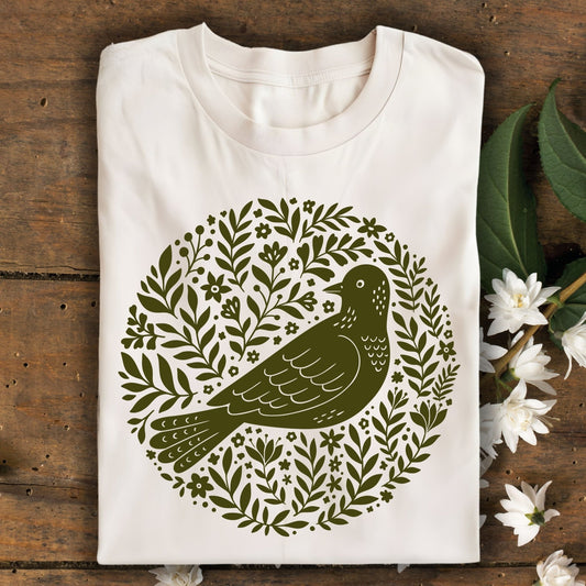 Natural S-size t-shirt with a dark green Scandinavian bird art design in a floral wreath.