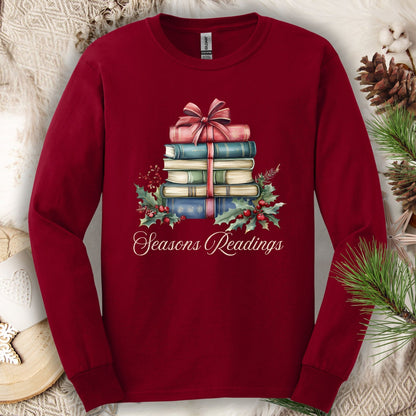 Cardinal Red long sleeve tee with watercolor stacked Christmas books, bow, holly, and "Seasons Readings" text.